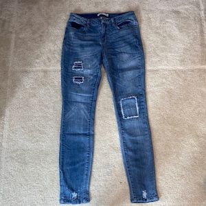 Mudd skinny, decent stretch jeans with distressed patchwork.